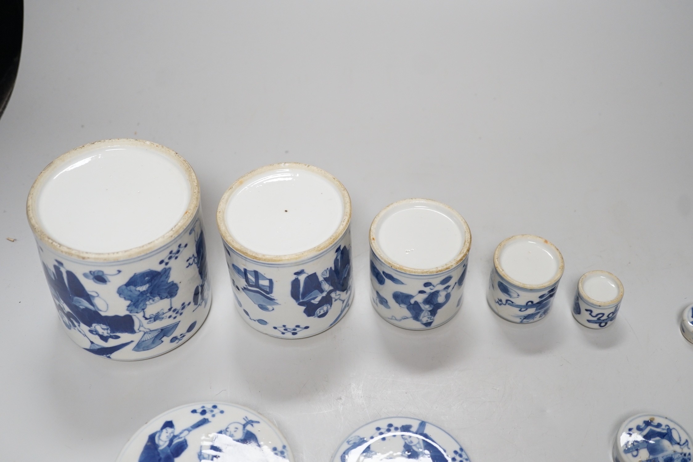 A set of four 19th century Chinese graduated blue and white jars and covers and a small jar with another design (5). Tallest 12cm